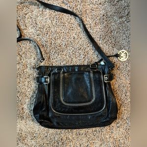 Black crossbody Michael kors purse.